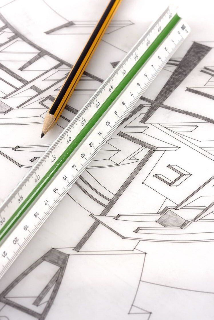 Architectural drawing with green scale and pencil on top