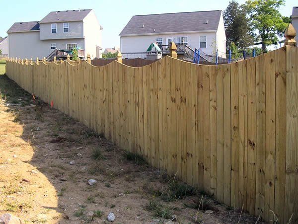 Scalloped top privacy fence with French Gothic Post