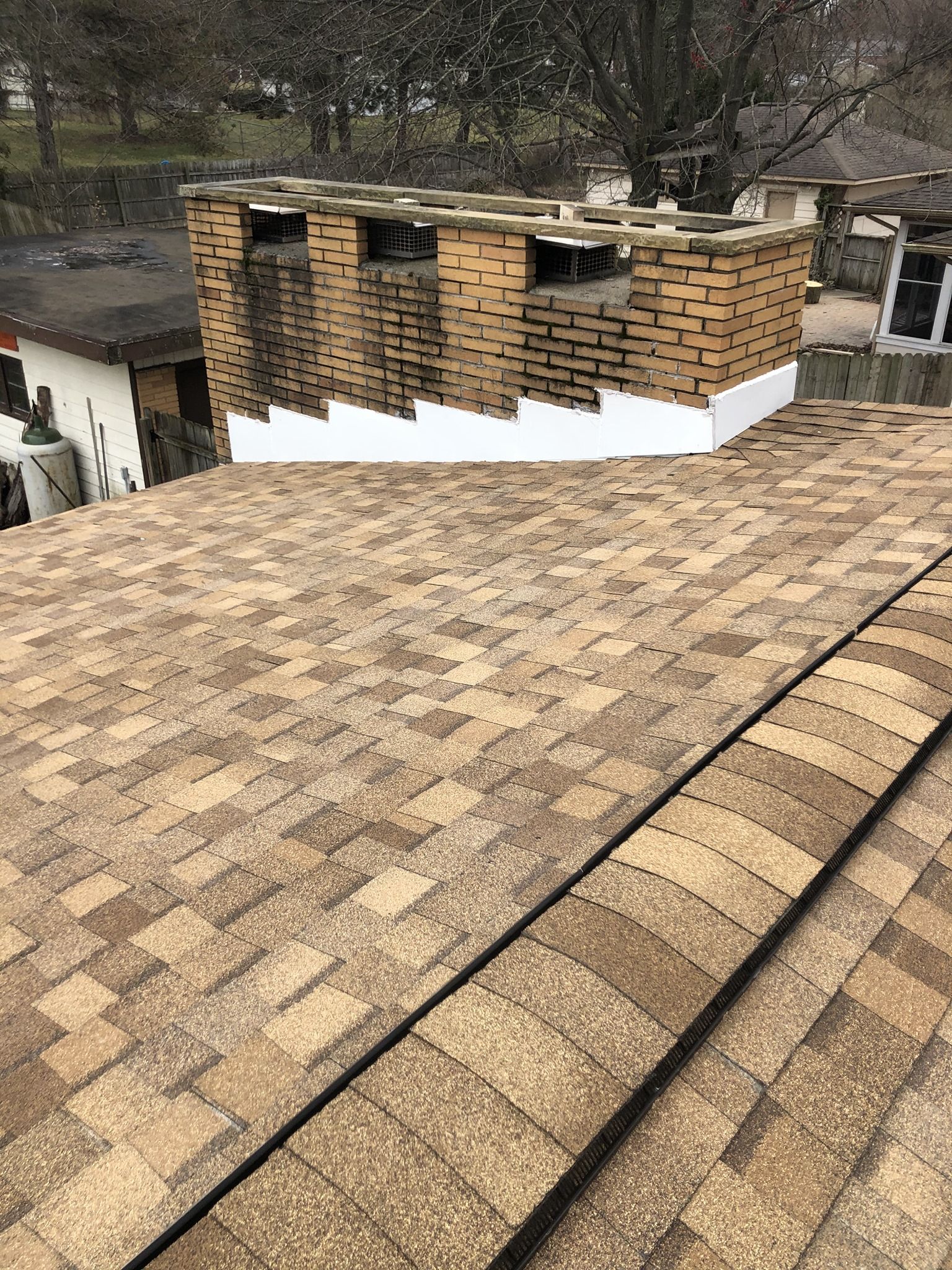 A roof with a chimney on top of it.