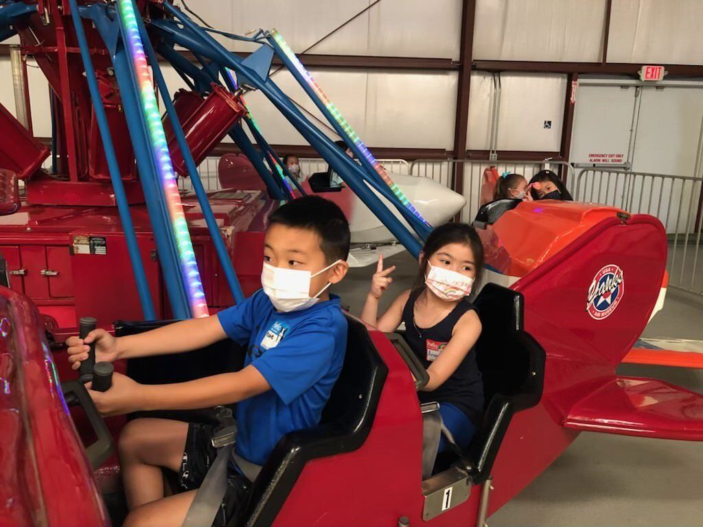 Kids on Airplane Ride — Chino Hills, CA — Sunshine Montessori School Of Chino Hills