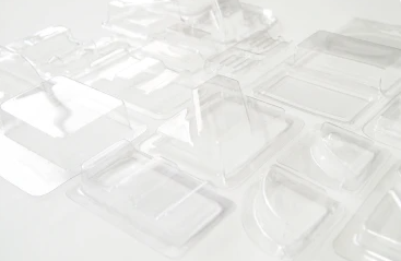 A yellowish banana in black blackground