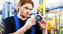 The engineer is inspecting the 3d printed part which use as a jigs