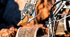 Customise robot picking up a rock