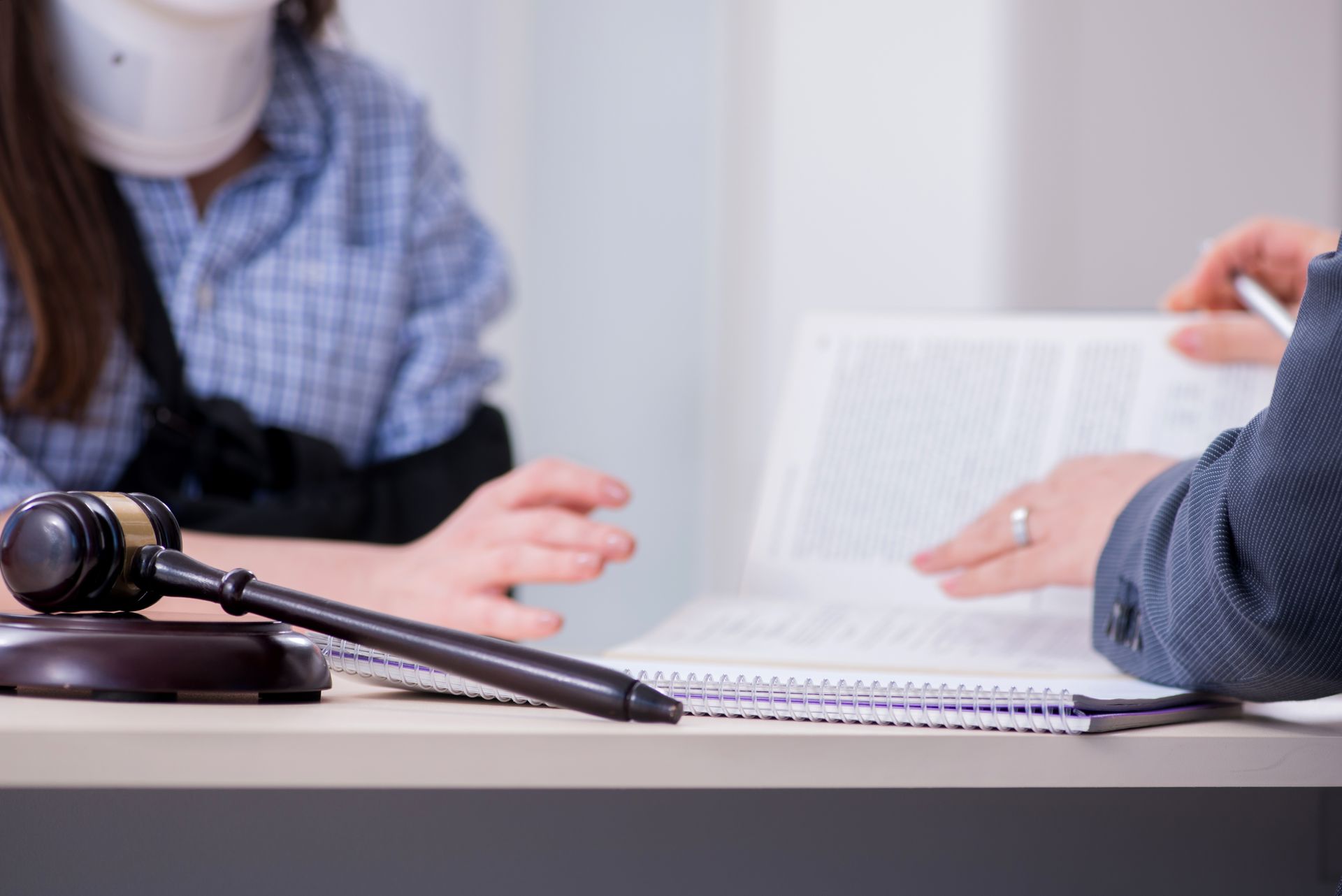 Injured employee visiting workers' compensation attorney.