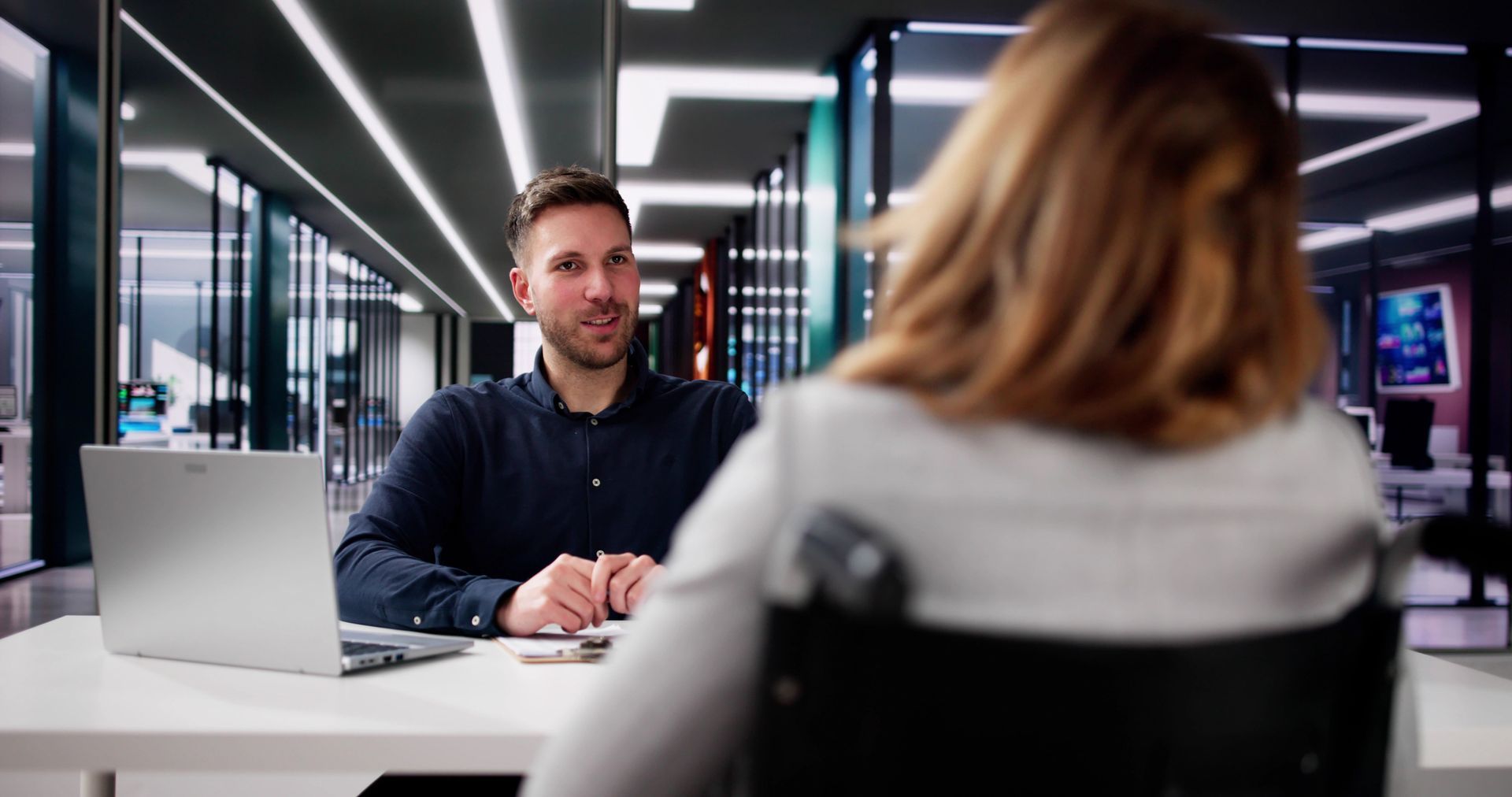A lawyer is talking with an injured client. A lawyer is talking with an injured client.