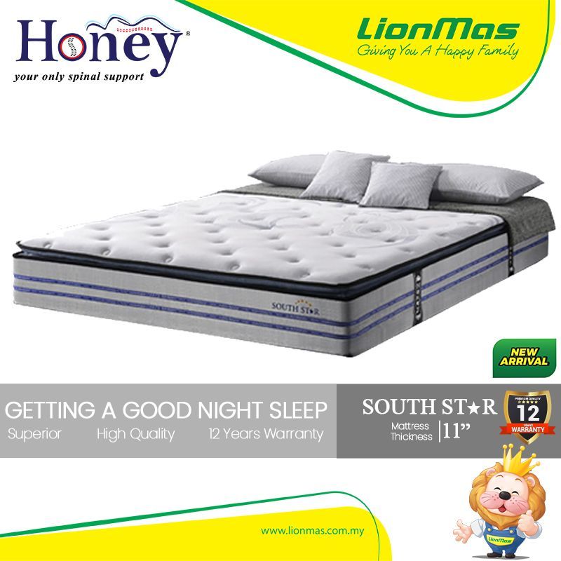 A honey mattress is sitting on top of a bed