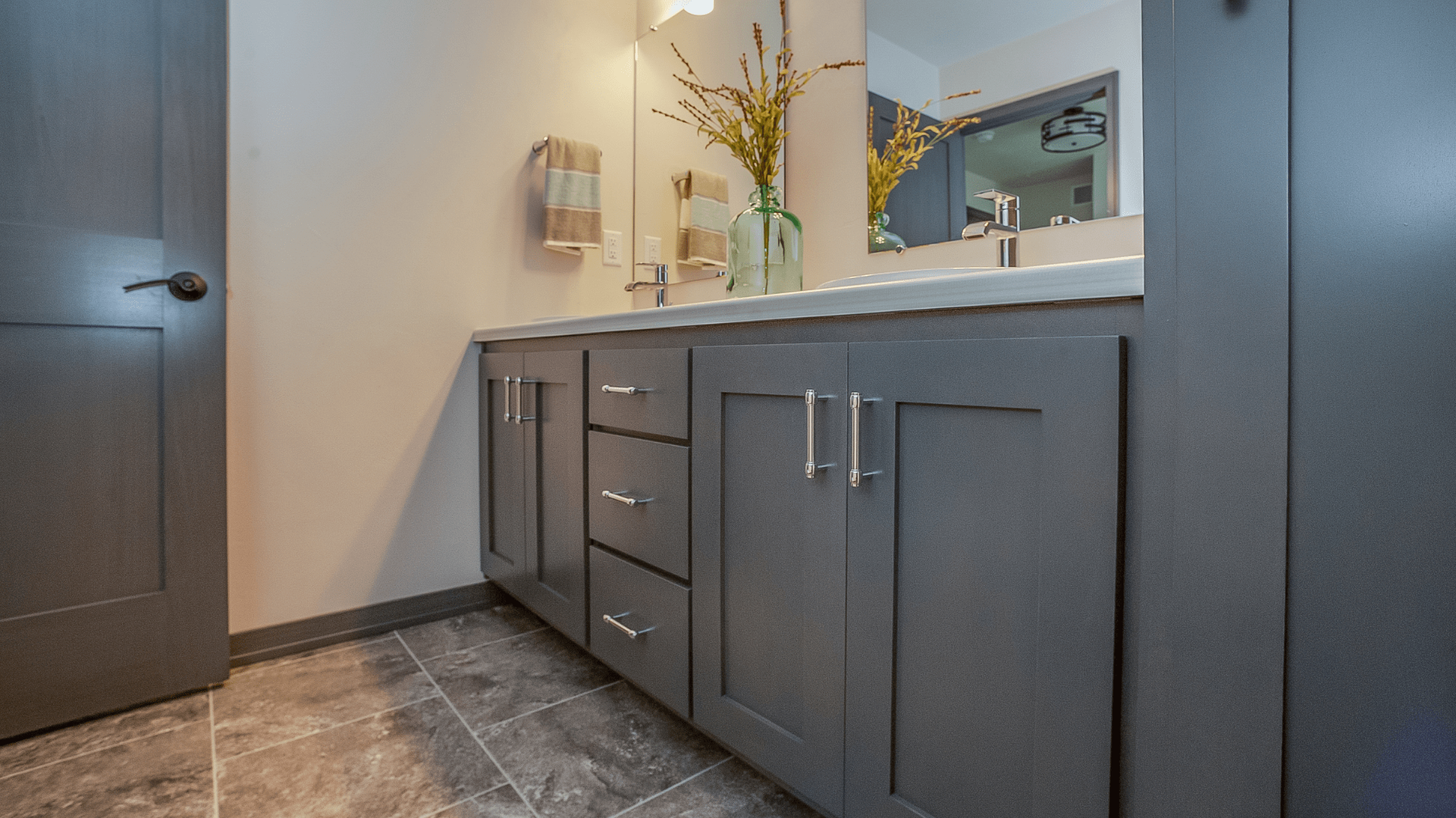 Grey bathroom vanity with drawers and cabinets, two sinks, and mirror — Morrison Cabinetry in Cedar Pocket, QLD