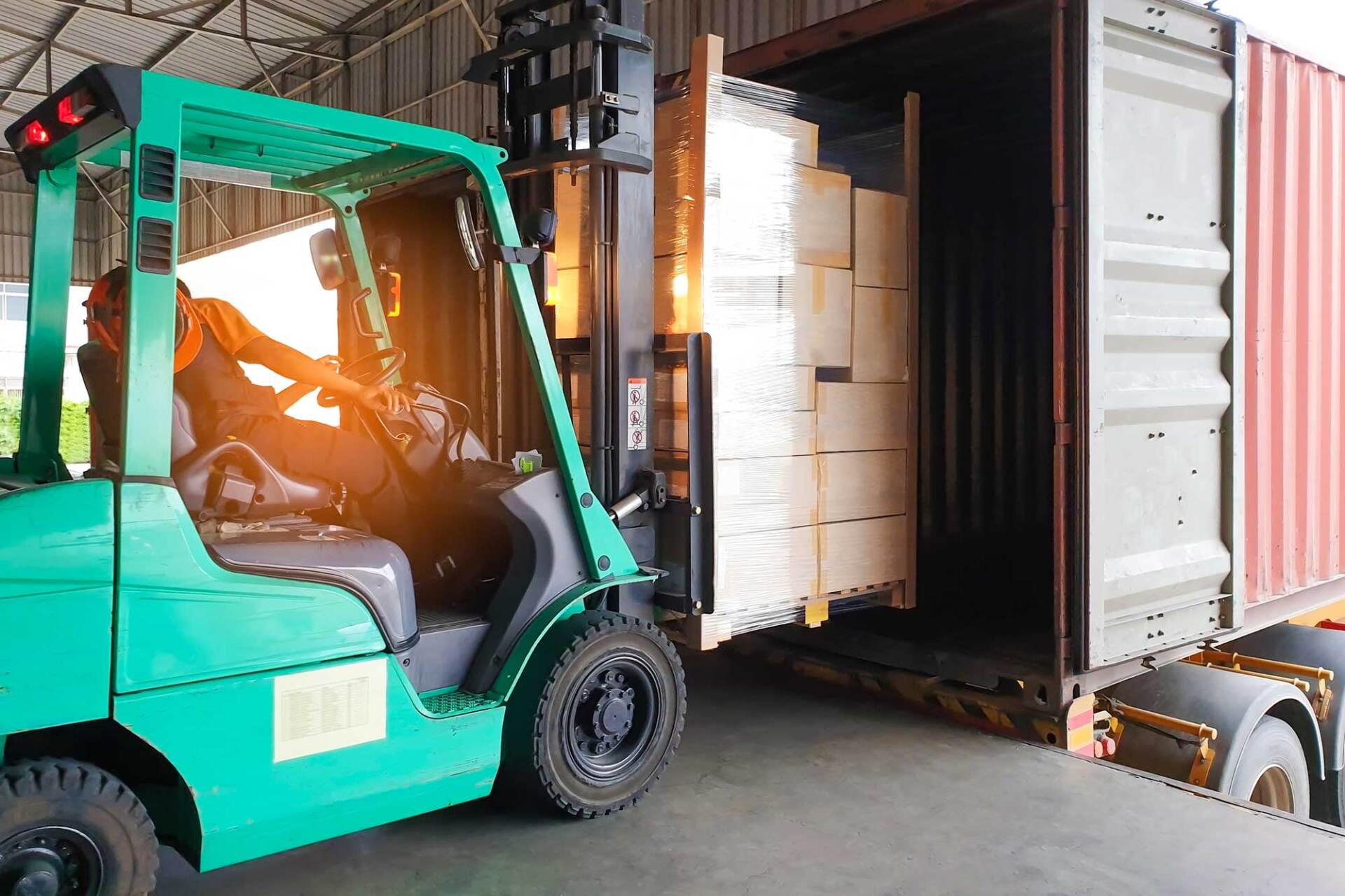 Forklift Driver Loading Goods Pallet Into the Truck — Glasgow, KY — Sneed Logistics INC