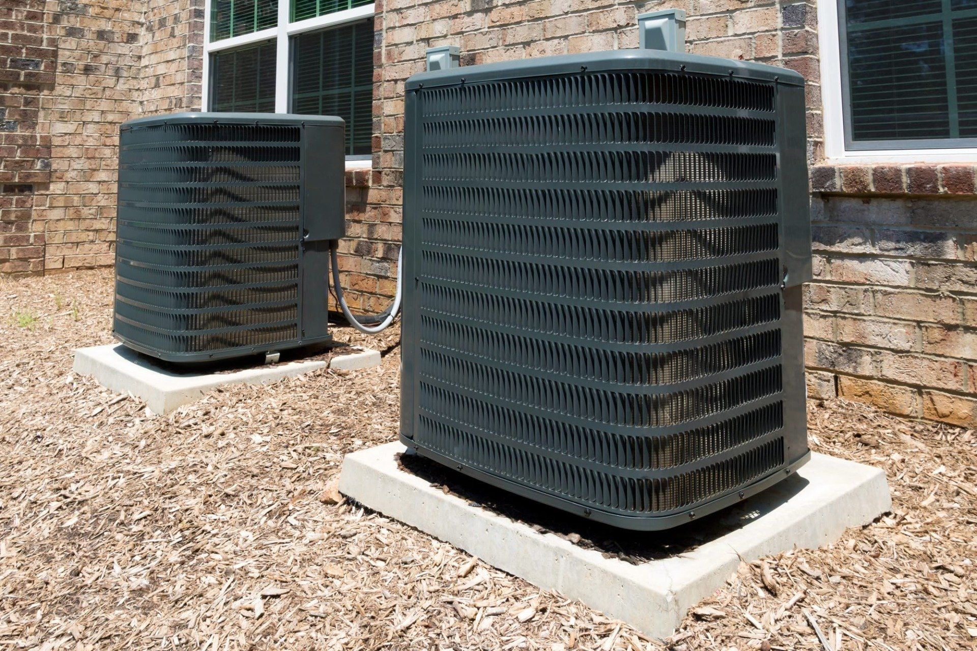 2 hvac systems outside of brick house