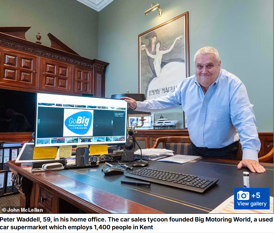 Peter Waddell in home office with computer, Big Motoring World logo displayed.