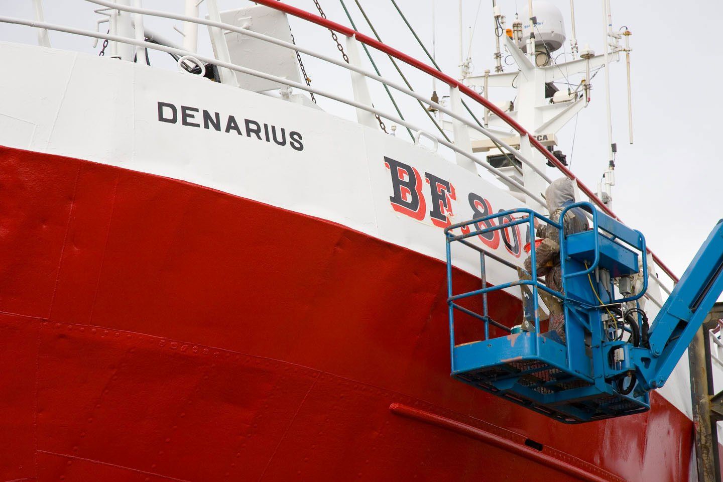 Cherry Pickers being used at Fraserburgh Harbour and boat yard Aberdeenshire, Scotland uk