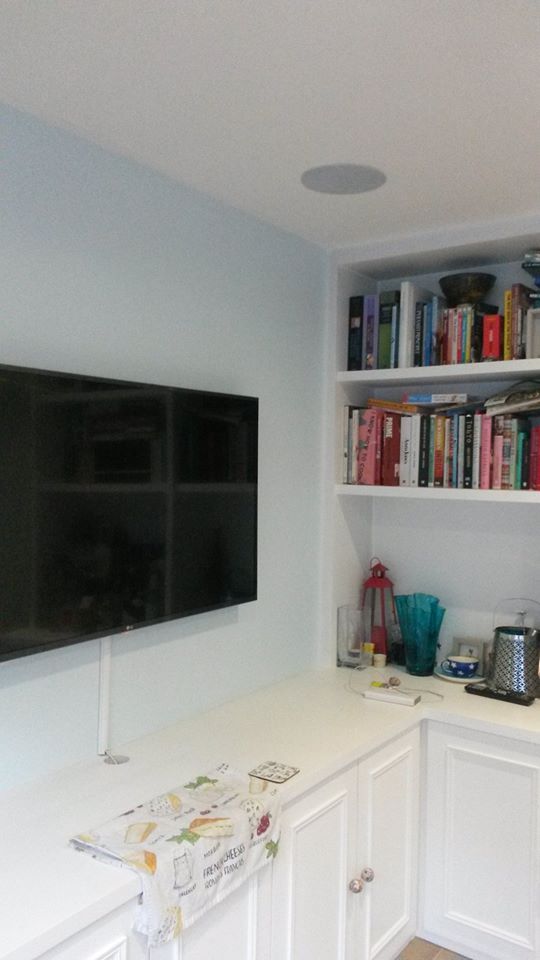 Living room wall TV hanged and book shelves