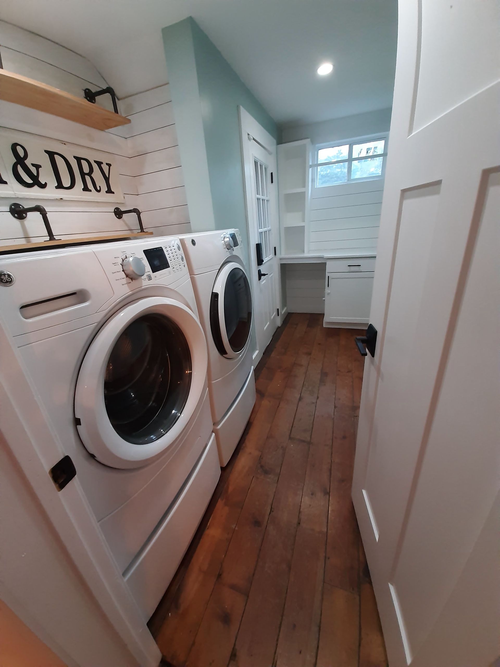 A laundry room with a sign that says laundry and dry