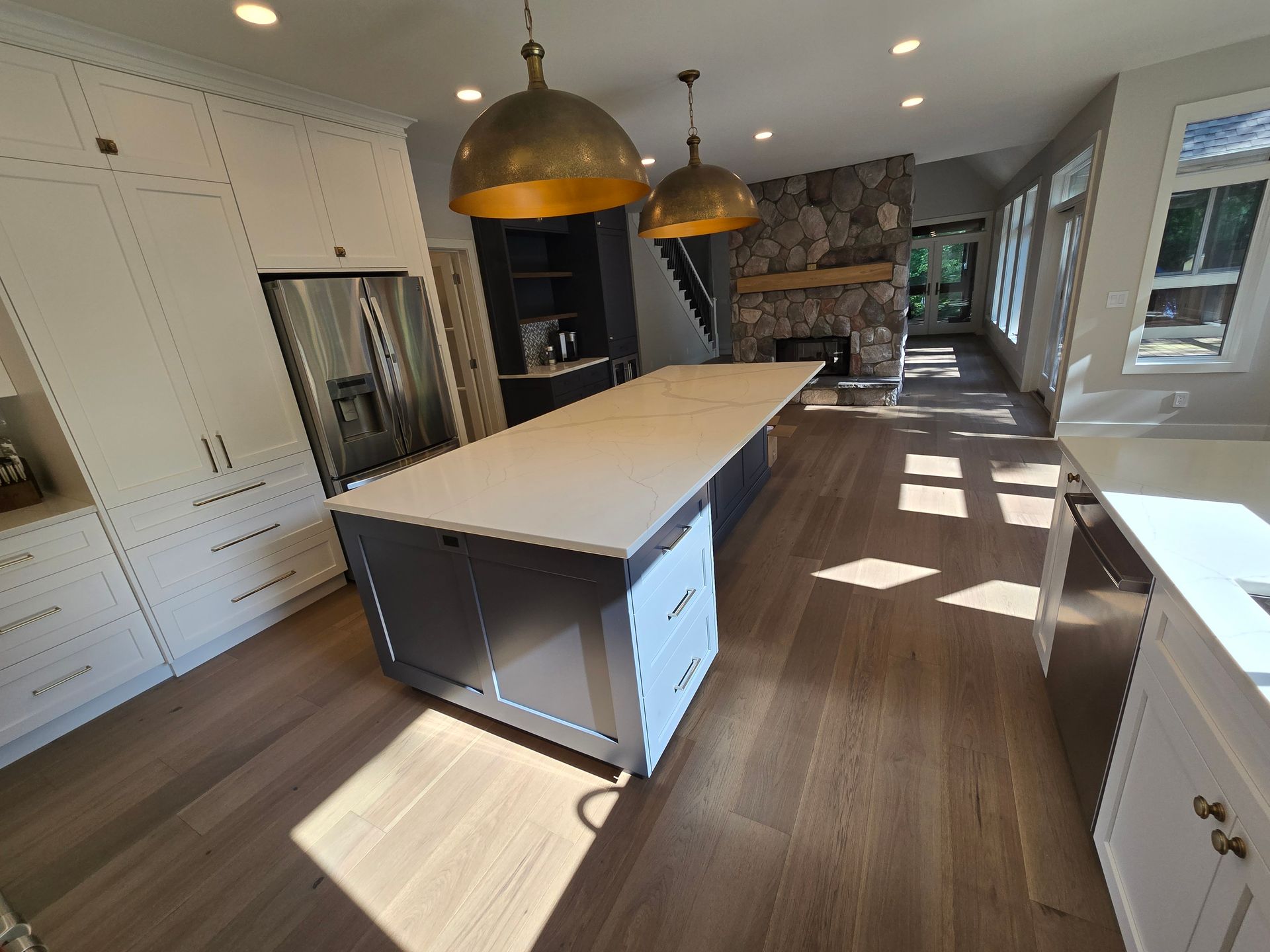 There is a large island in the middle of the kitchen.
