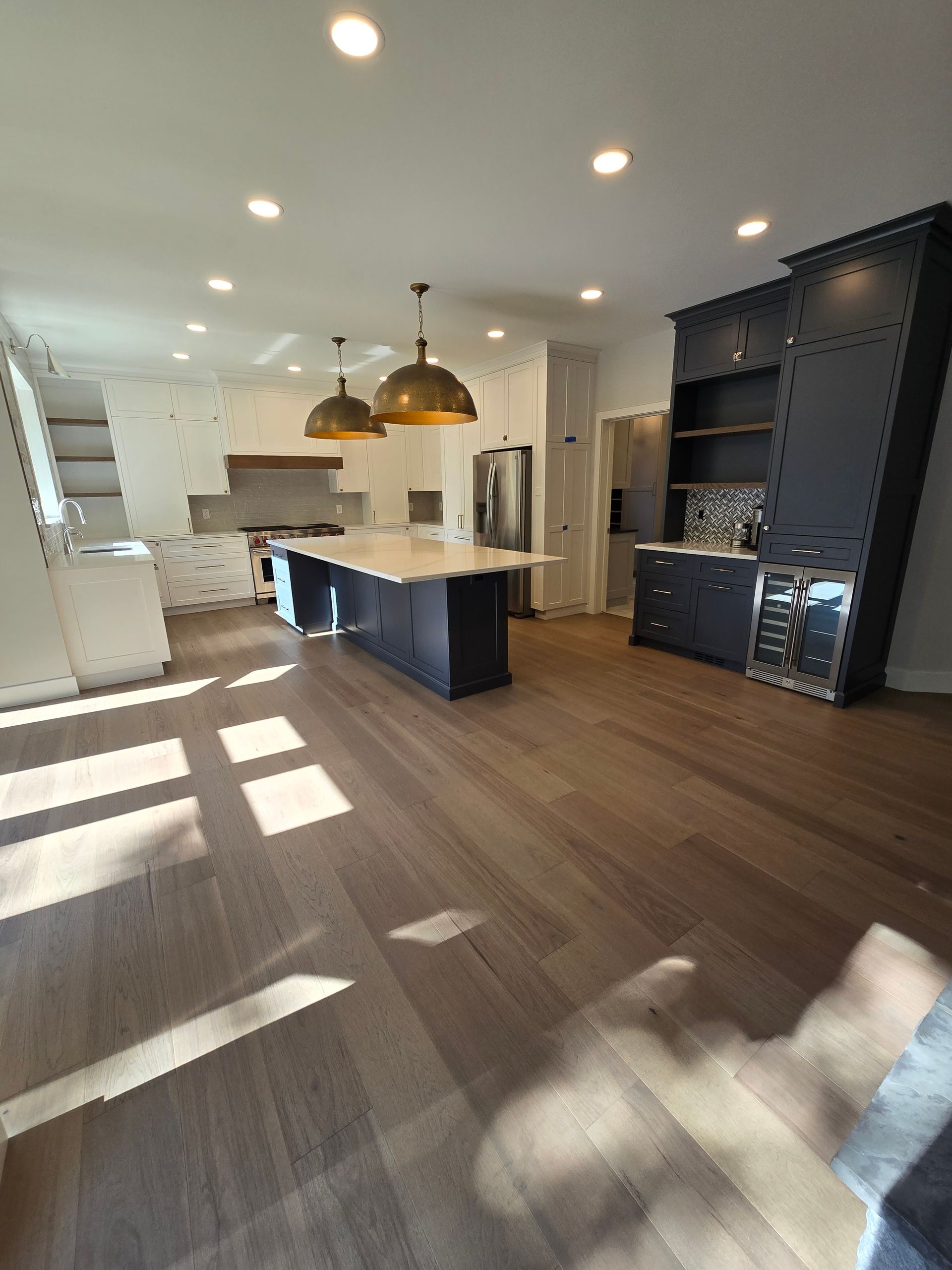 A kitchen with a large island in the middle of the room.