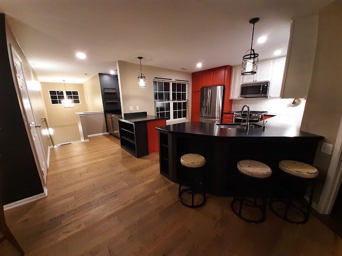 A kitchen with a large island and stools