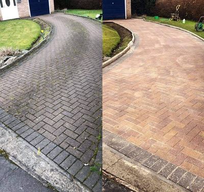 Before and after of a brick paver driveway cleaning. The left side is dirty, the right side is clean.