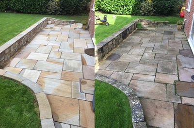 Before and after of a stone patio; left side cleaned, right side uncleaned, showing the impact of cleaning.