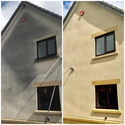 A side-by-side showing a house wall before and after cleaning. The cleaned wall is beige; the uncleaned wall is grey.