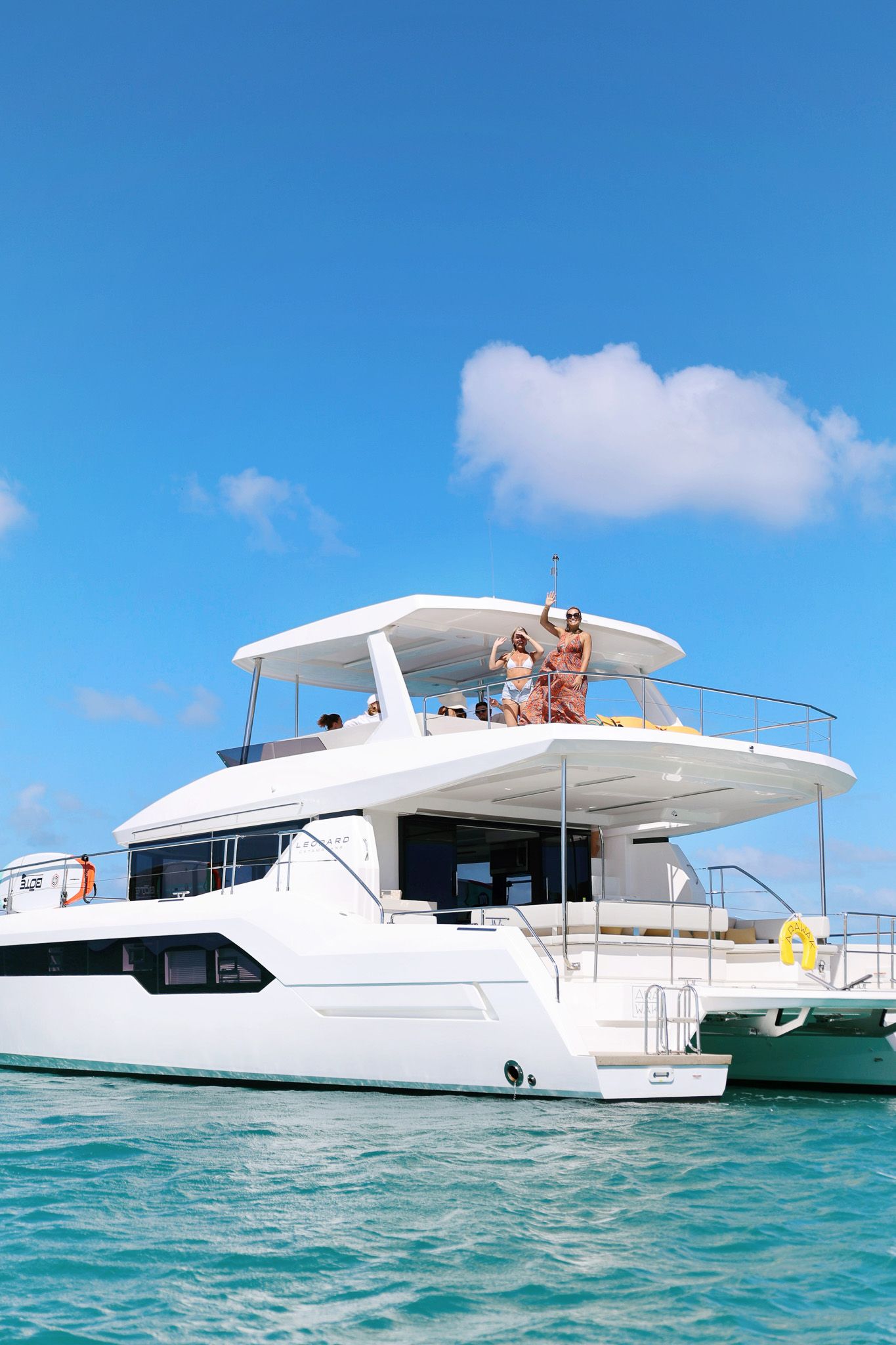 Power Cat 53 feet Leopard by Arawak Charters, view from side with blue sky in Anguilla