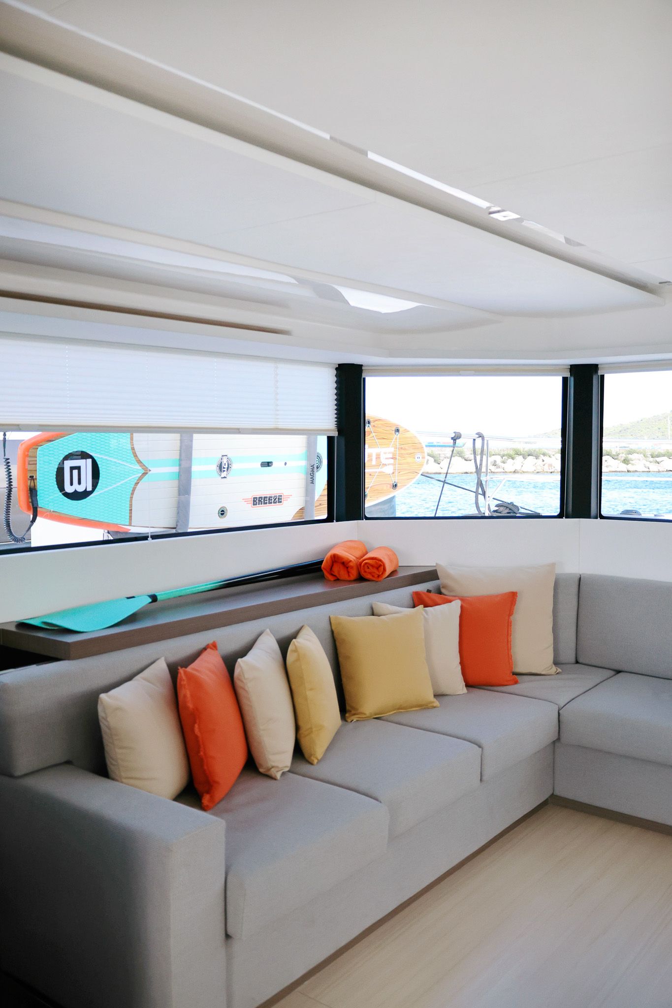 Inside view of Leopard Power Catamaran 2025 with paddleboard outside