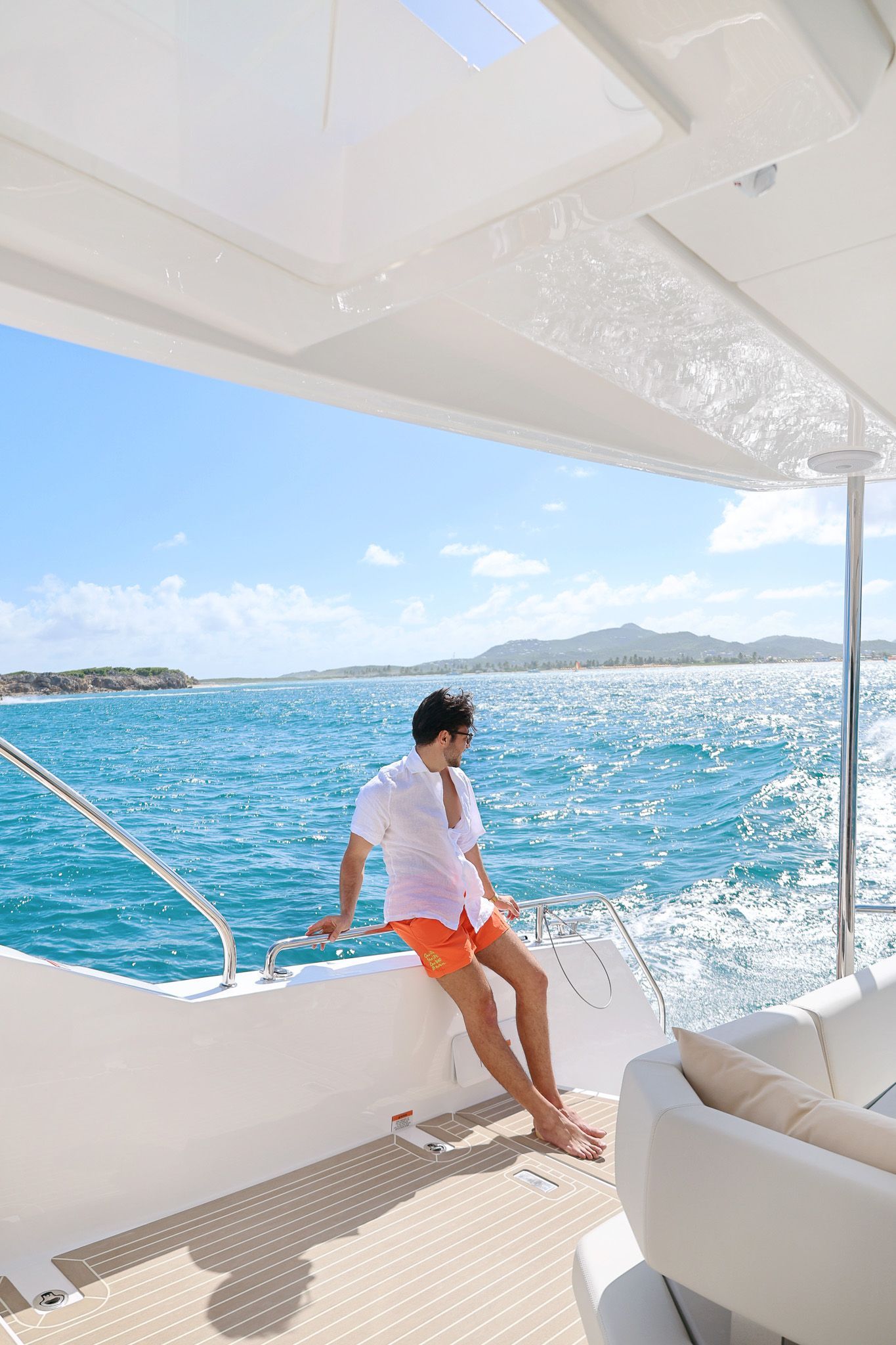 Guest enjoying his day on the boat with sea view