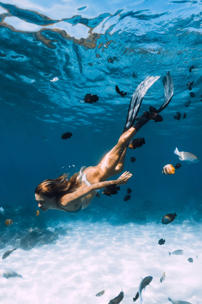 Snorkeling in Carribean with adapted gear in turquoise crystal sea 