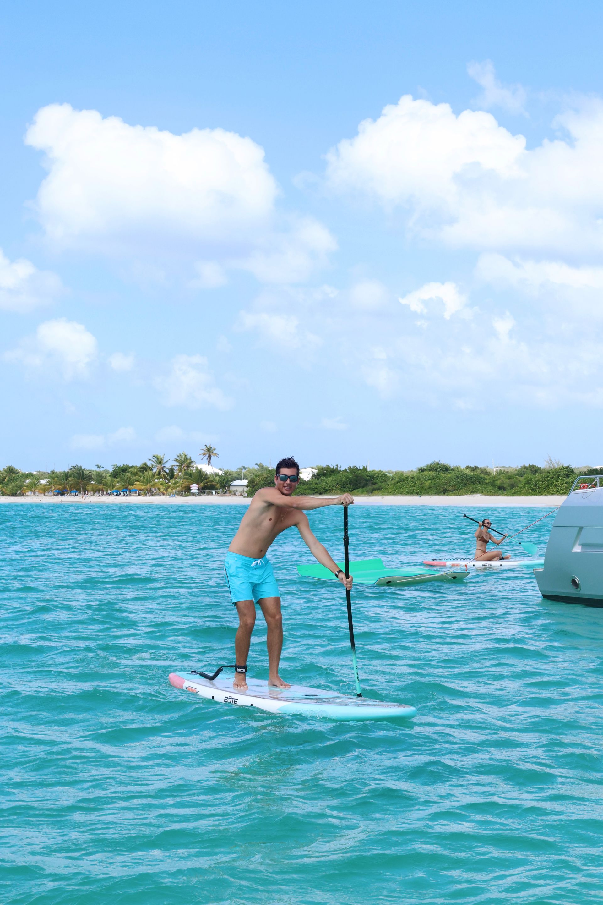 Guest on a paddleboard enjoying his day at Anguilla with Arawak Charters 