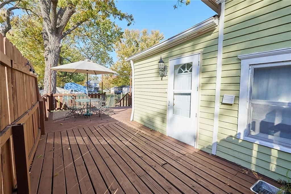 An exterior patio design with outside umbrelloa