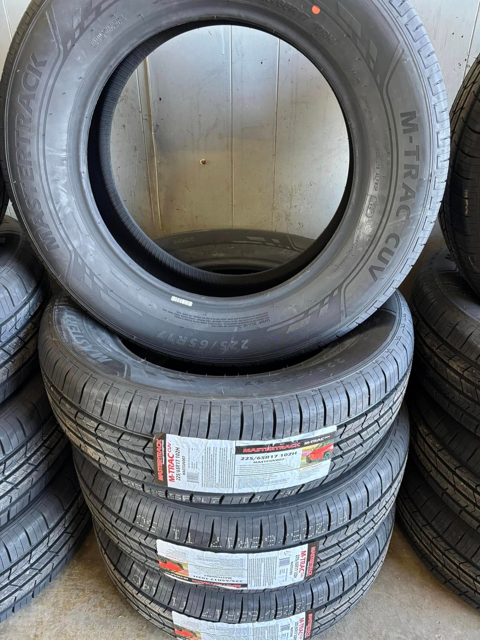 A pile of tires are stacked on top of each other.