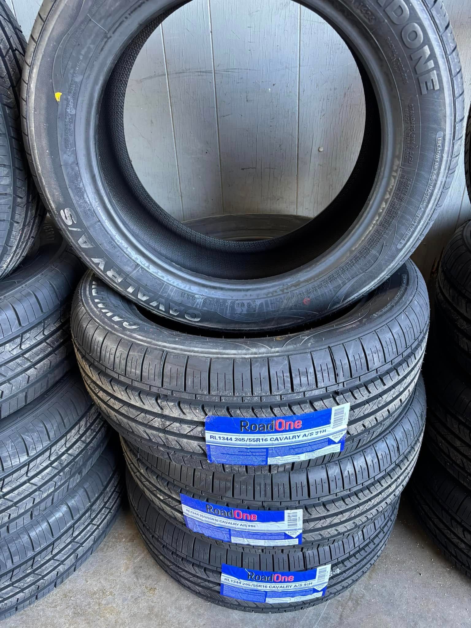 A bunch of tires are stacked on top of each other.