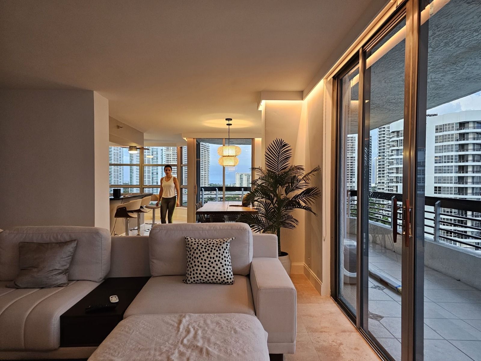 A living room with a couch and sliding glass doors