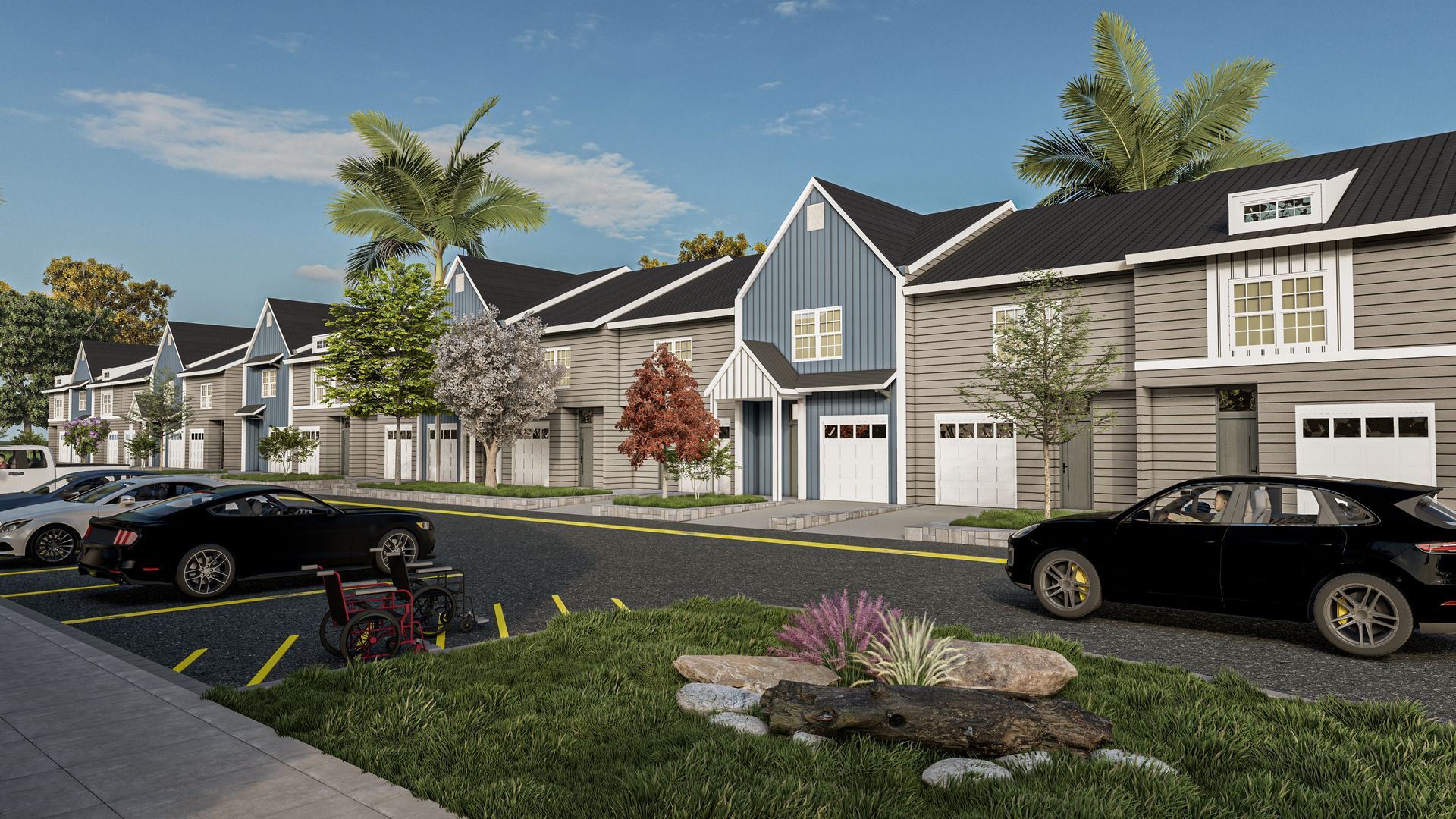 Row of modern townhouses with cars parked along the street; sunny day.