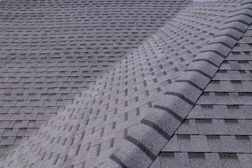 A close up of a roof with shingles on it.