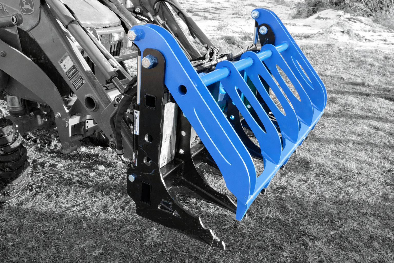 A black and white photo of a root rake grapple