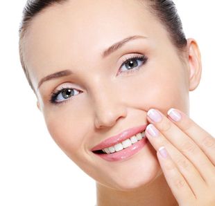 Woman happy with her family dentist in Auckland