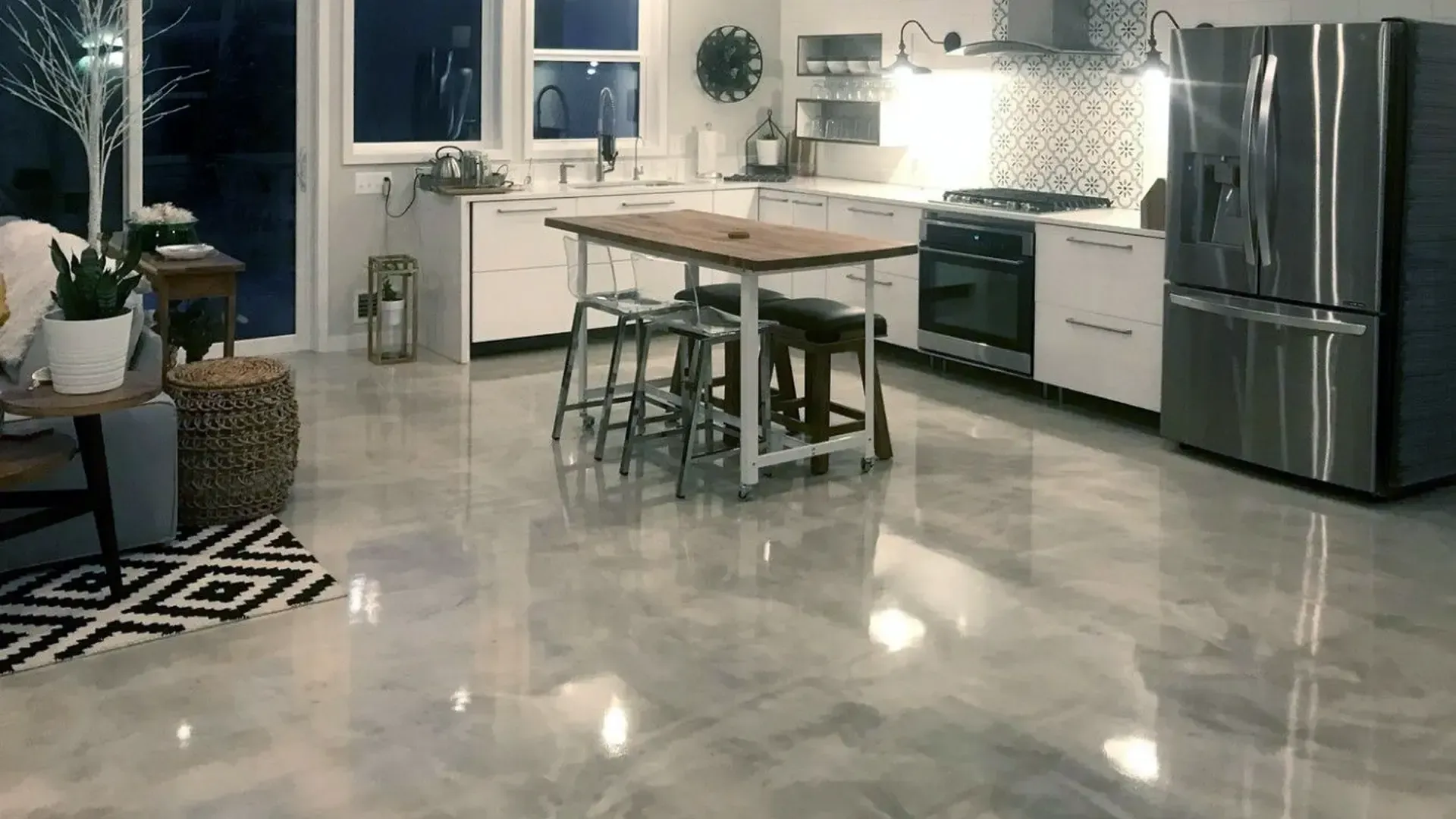 A garage with a black and white epoxy floor.