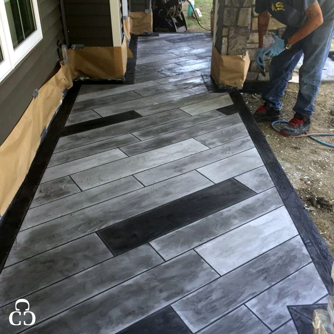 A garage with a concrete floor and a garage door.