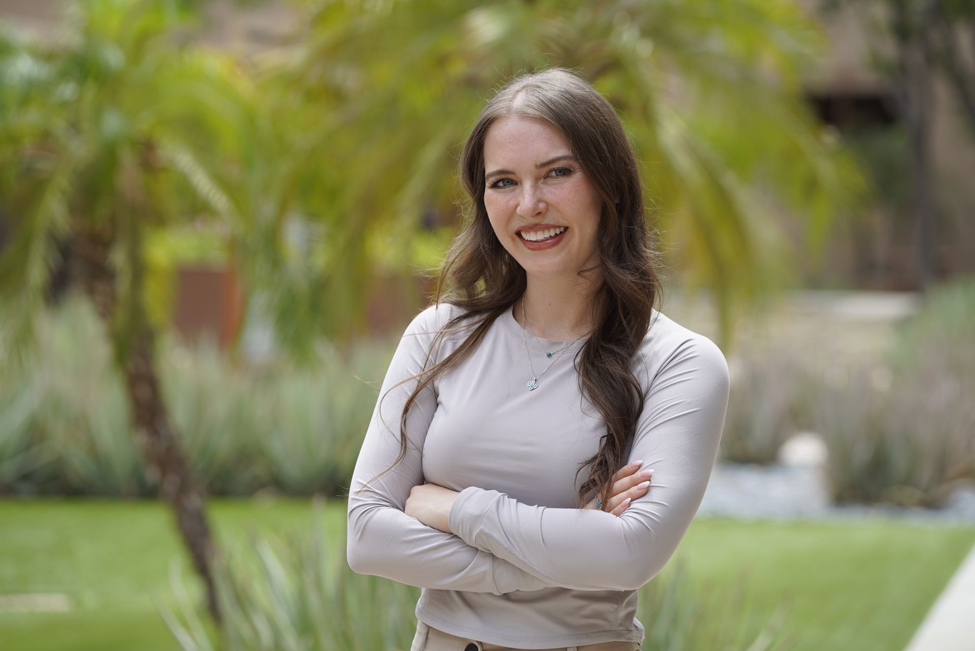 Modern white bathroom with a double sink vanity, soaking tub, and towel warmer.