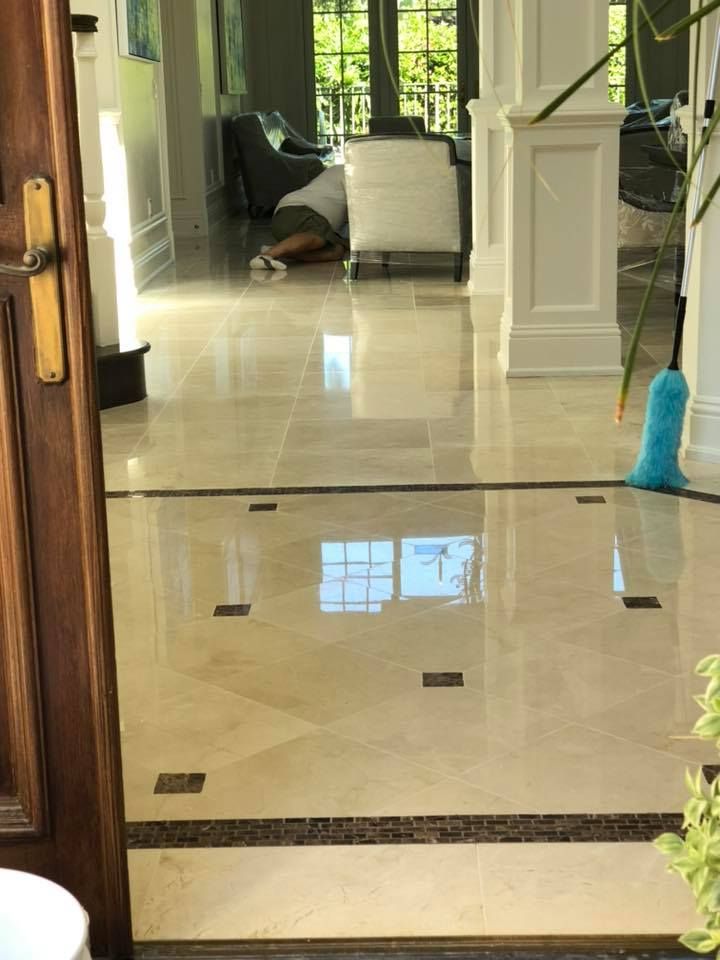 A person is laying on the floor in a living room.