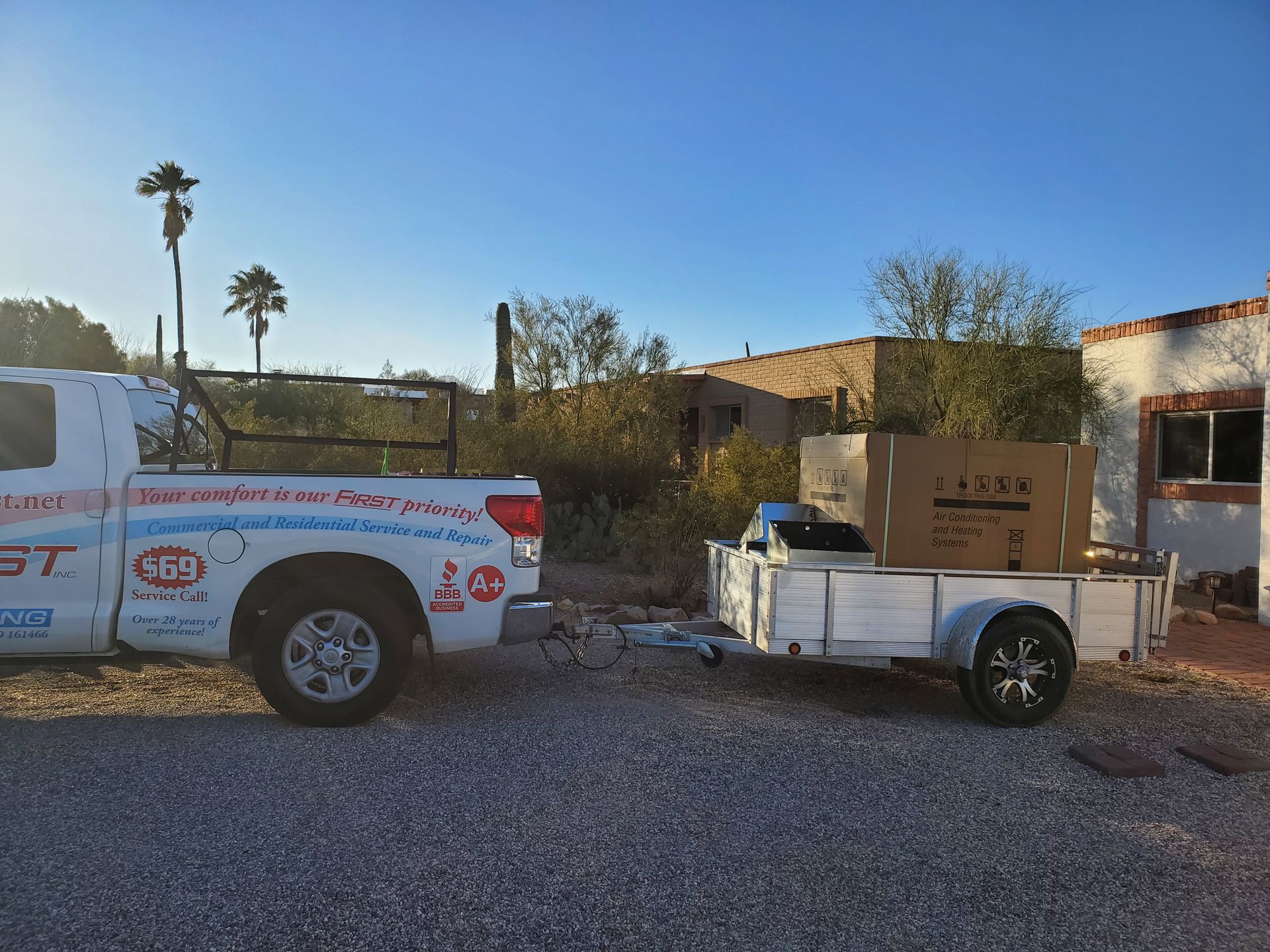 AC First Service Car carrying new HVAC Unit — Tucson, AZ — A C First Inc