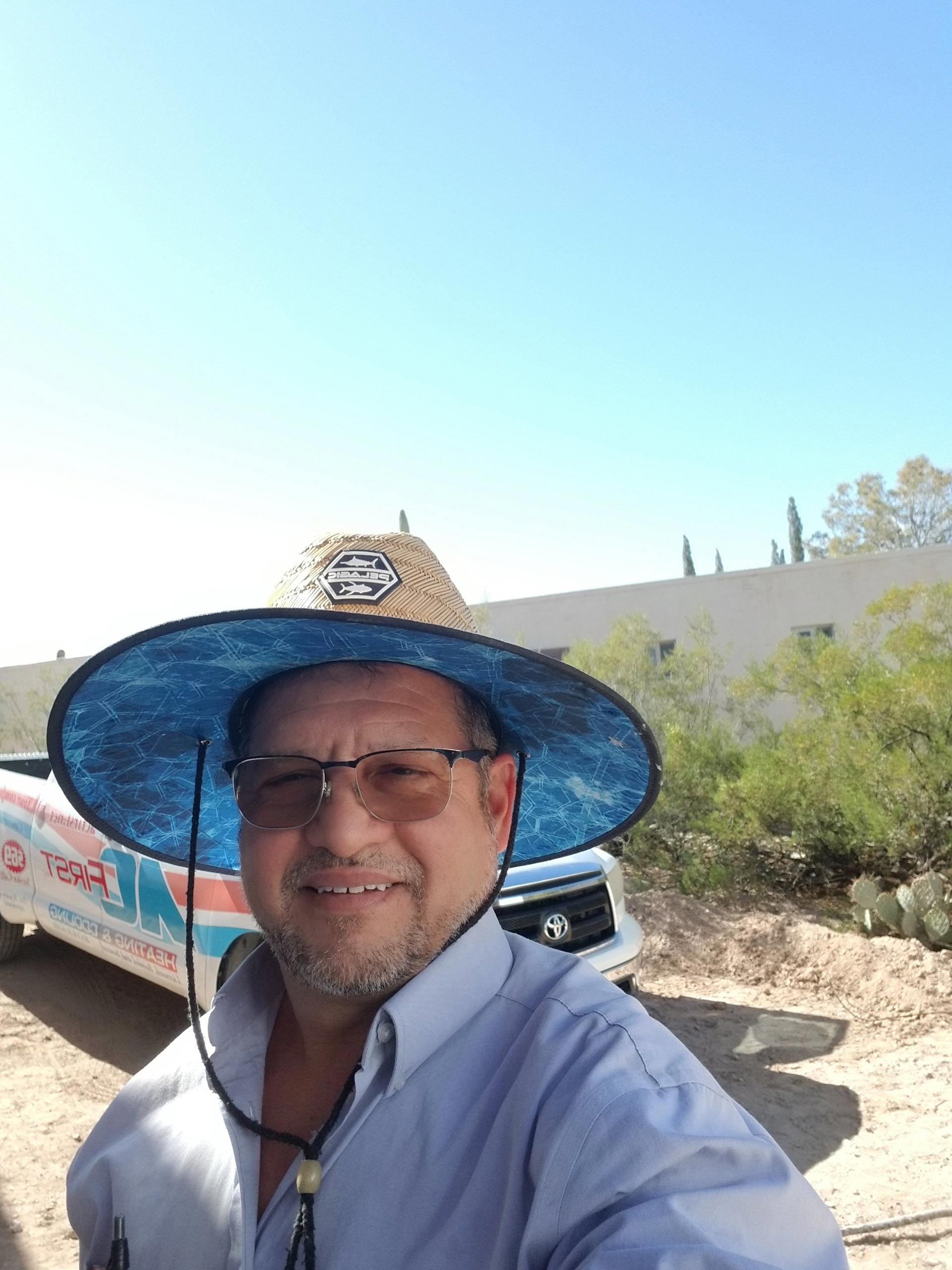 Man Smiling with Pick up Car on The Background — Tucson, AZ — A C First Inc