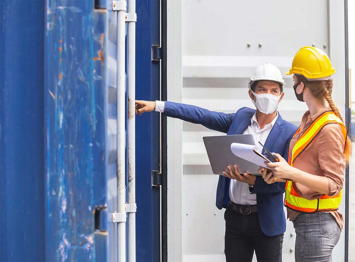 Safety Trainer Showing Safety Procedures to a Worker.