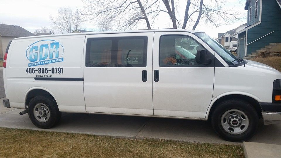 A white van with the word sda on the side