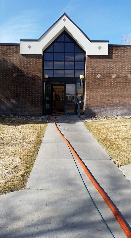 A brick building with a walkway leading to it