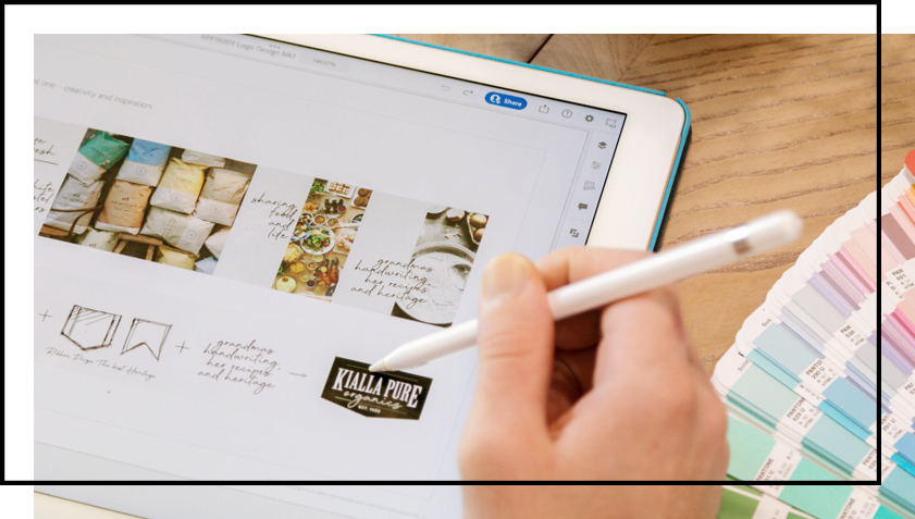 A person is drawing on a tablet with a pencil.