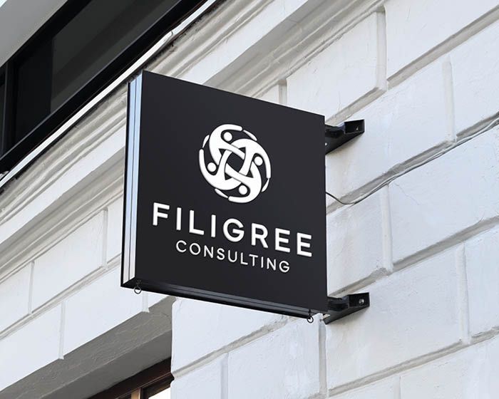 A sign on the side of a building that says filigree consulting