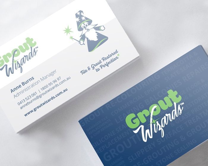 A business card for a company called grout wizards