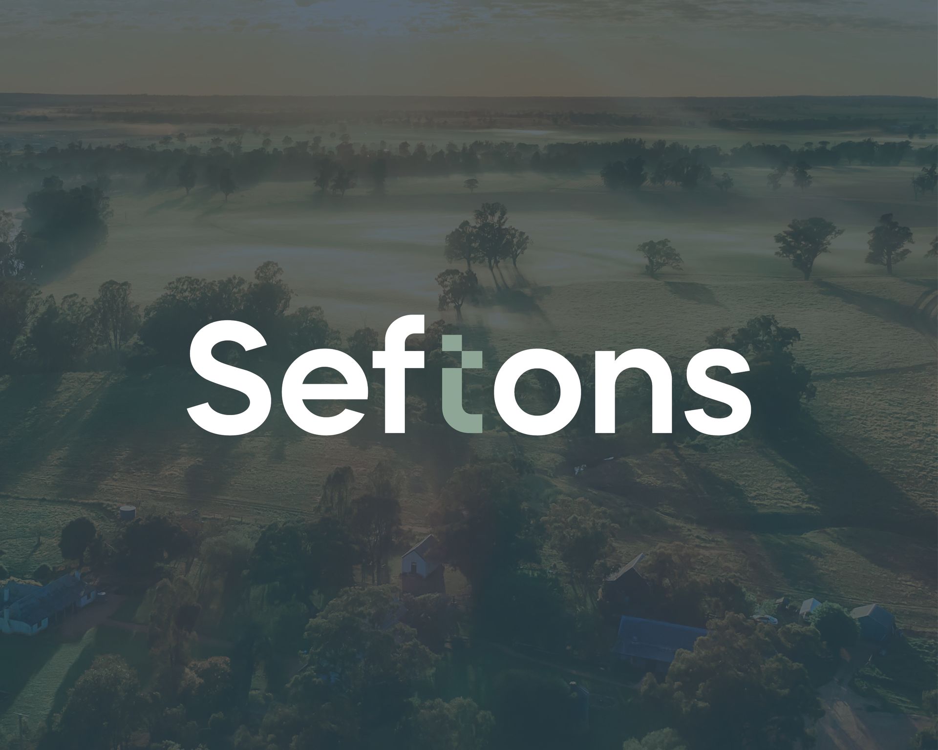 The word seftons is on a dark background with trees in the background.