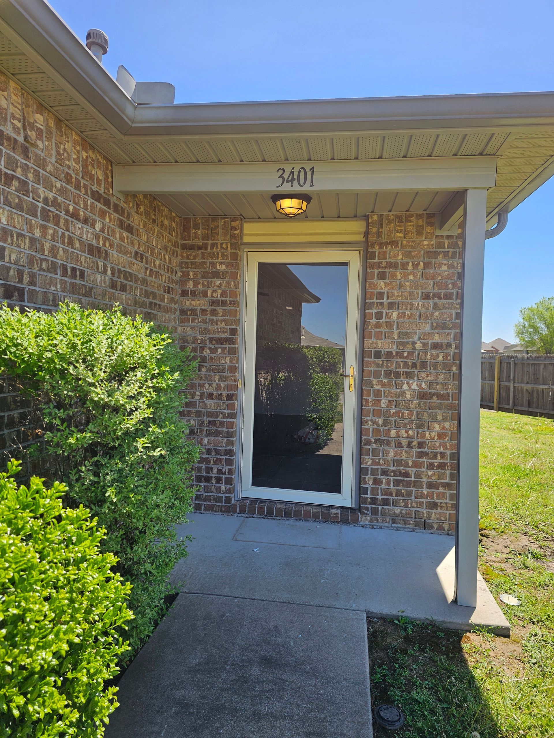 A bathroom with a toilet , sink , and bathtub.